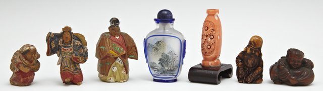 Group of Seven Oriental Items, 20th c., consisting of: Group of Seven Oriental Items, 20th c., consisting of three netsukes, two carved and polychromed wood figures, a reverse painted snuff bottle, and a carved coral snuff bottle on stand, lacking the sto