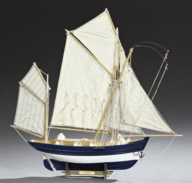 Carved Wooden Model of a Yawl Rigged Fishing Boat, 20th: Carved Wooden Model of a Yawl Rigged Fishing Boat, 20th c., with four sails, on a custom wooden stand, H.- 23 1/2 in., W.- 20 in., D.- 5 5/8 in.