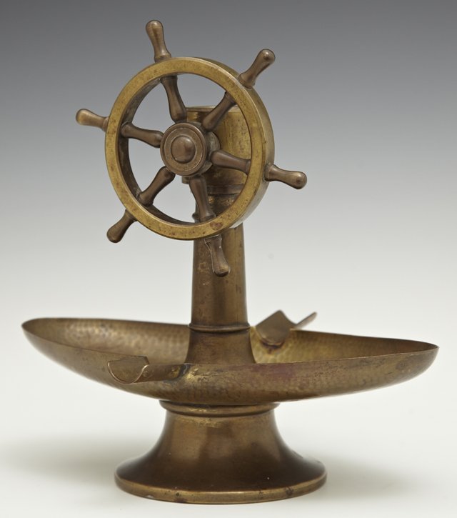 Unusual Continental Brass Hand Hammered Cigar Cutter: Unusual Continental Brass Hand Hammered Cigar Cutter Ashtray, c. 1900, in the form of a ship's wheel, H.- 7 1/2 in., W.- 7 3/8 in., D.- 5 7/8 in.