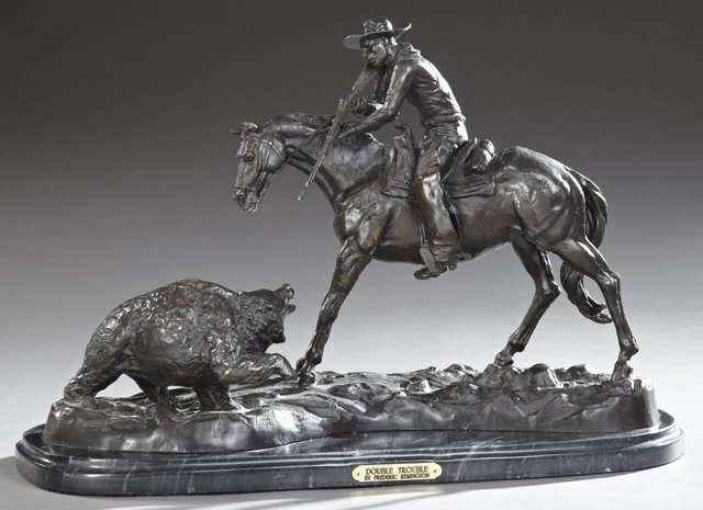 After Frederic Remington (1861-1909), "Double Trouble,": After Frederic Remington (1861-1909), "Double Trouble," 20th c., patinated bronze, on a stepped oval highly figured black marble base, H.- 18 in., W.- 26 1/2 in., D.- 12 in.