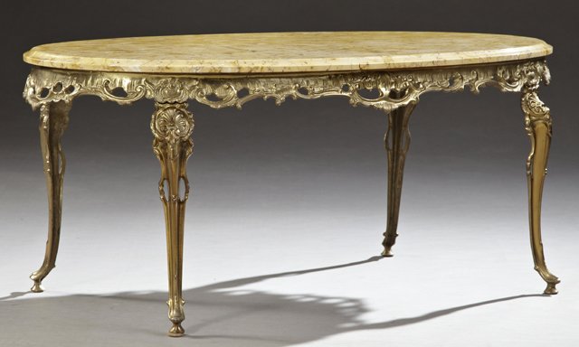 French Rococo Style Gilt Brass Marble Top Coffee Table,: French Rococo Style Gilt Brass Marble Top Coffee Table, mid 20th c., the stepped edge oval highly figured ochre marble, over a pieced relief rocaille skirt, on shell decorated cabriole legs, H.- 17 1/