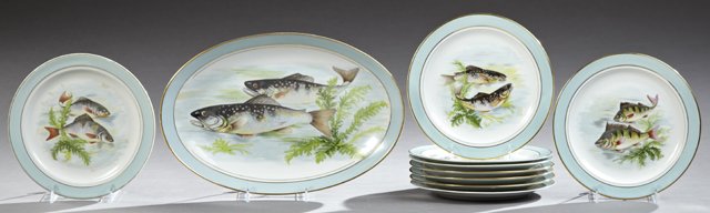 French Ten Piece Porcelain Fish Set, 20th c., by C.: French Ten Piece Porcelain Fish Set, 20th c., by C. Bernaudaux and Cie., consisting of nine plates and an oval platter, all with gilt trims and pale aqua banding around transfer reserves of fish, Plat