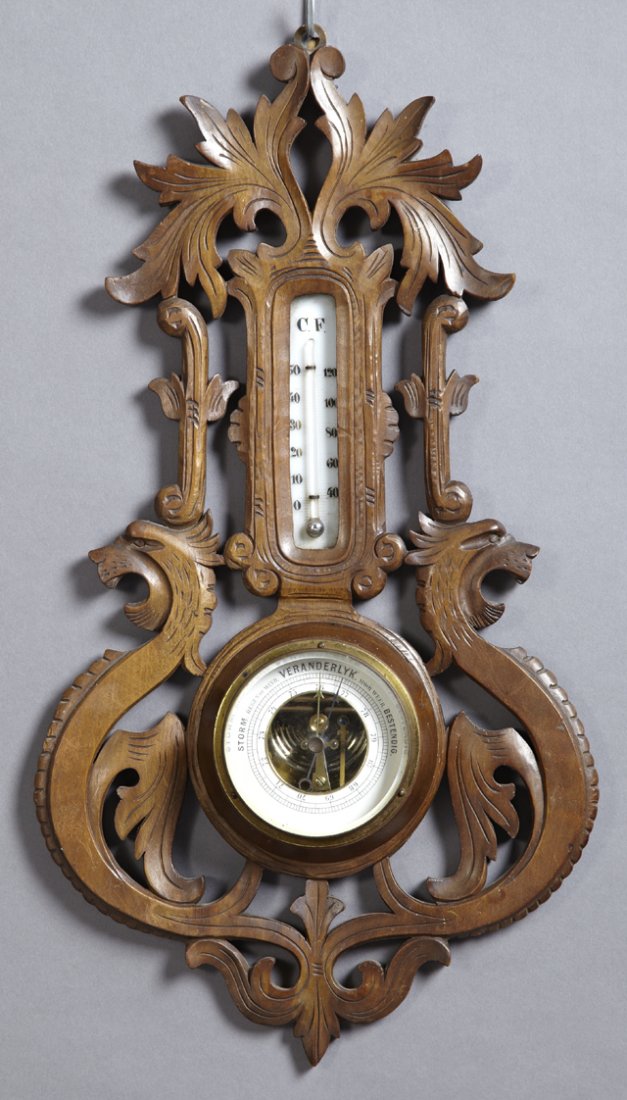Dutch Carved Mahogany Barometer/Thermometer, c. 1900,: Dutch Carved Mahogany Barometer/Thermometer, c. 1900, with pierced dragon and leaf carving, H.- 18 3/4 in., W.- 10 1/8 in., D.- 2 in.