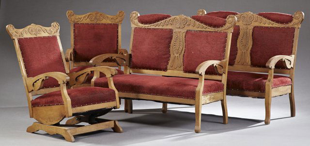 Four Piece American Eastlake Carved Oak Parlor Suite,: Four Piece American Eastlake Carved Oak Parlor Suite, c. 1900, consisting of two settees, an armchair, and a rocking chair, with serpentine scrolled foliate applied crest rails over square upholstered