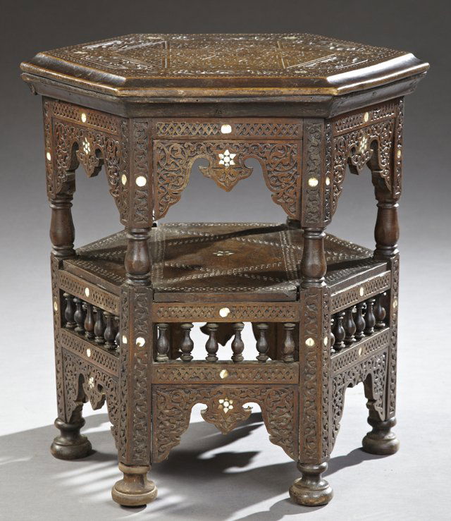 Moroccan Abalone Inlaid Heavily Carved Side Table, 20th: Moroccan Abalone Inlaid Heavily Carved Side Table, 20th c., the stepped hexagonal top with a carved fretwork star surrounded by an Arabic inscription of the five pillars of Islam, over an open shelf,
