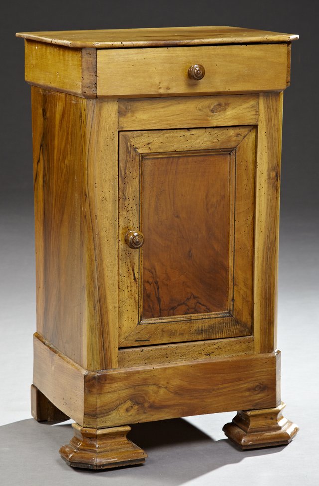 French Louis Philippe Carved Walnut Nightstand, mid: French Louis Philippe Carved Walnut Nightstand, mid 19th c., the canted corner top over a frieze drawer, above a cupboard door flanked by chamfered stiles, on a plinth base on stepped ogee feet, H.- 2