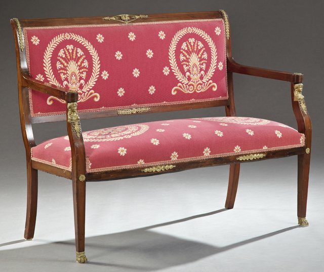 French Empire Style Ormolu Mounted Carved Mahogany: French Empire Style Ormolu Mounted Carved Mahogany Settee, 19th c., the tablet crest centered by a Minerva ormolu mount, to a rectangular seat within tapered arms on female bust supports, to tapered s