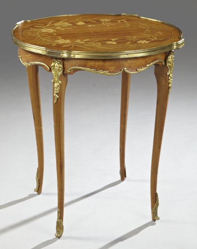 American Ormolu Mounted Marquetry Inlaid Side Table, ea: American Ormolu Mounted Marquetry Inlaid Side Table, early 20th c., Chicago, by Karpen, the Art Nouveau style floral inlaid top with a gilt brass edge over a serpentine ormolu mounted skirt, on ormolu