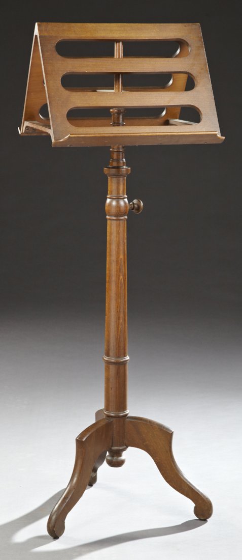 French Louis Philippe Style Carved Beech Double Music: French Louis Philippe Style Carved Beech Double Music Stands, early 20th c., the pierced double sided rotating stand, on a ring turned tapered support to tripodal flat serpentine legs, H.- 47 in., W.-