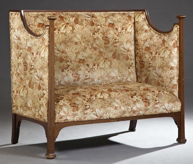 English Edwardian Carved Mahogany High Back Settee, c.: English Edwardian Carved Mahogany High Back Settee, c. 1890, the back flanked by carved winged sides, to a rectangular seat within carved tapered stiles, to square feet, now in foliate upholstery, H.-