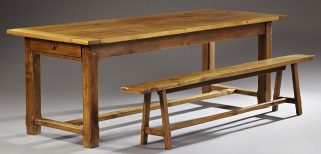 French Provincial Carved Cherry Farm House Table and a: French Provincial Carved Cherry Farm House Table and a Bench, early 20th c., the table with a rectangular top over a wide skirt centered by a single drawer and with a drawer at both ends, on square ch