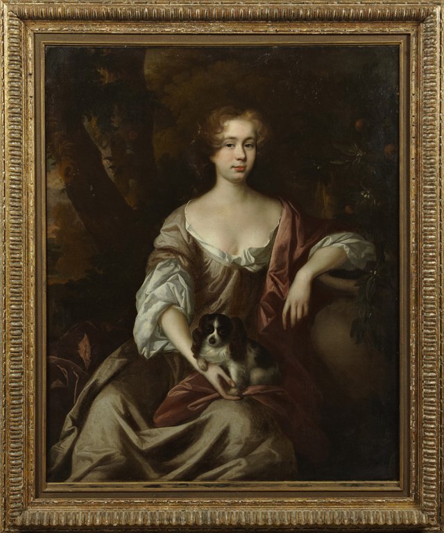 In the Manner of John Riley (1646- 1691, English), "Por: In the manner of John Riley (1646-1691, English), "Portrait of a Woman in a Garden with a Spaniel," 18th c., oil on canvas, presented in a carved giltwood frame, H.- 48 3/4 in., W.- 39 1/4 in.