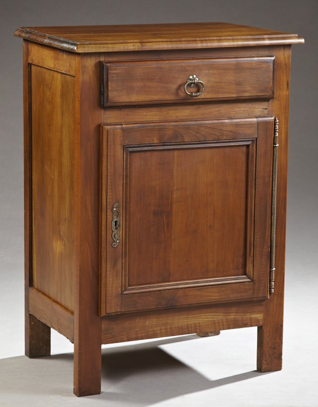 French Provincial Carved Cherry Confiturier, early 20th: French Provincial Carved Cherry Confiturier, early 20th c., the stepped top over a frieze drawer, above a single cupboard door with an iron escutcheon and long fiche hinge, on rectangular legs, H.- 33