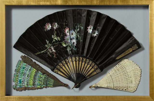 Group of Three Hand Fans, early 20th c., one of caned: Group of Three Hand Fans, early 20th c., one of caned bone, one of painted silk, one of painted cardboard, presented in a single gilt shadowbox frame, Interior- H.- 14 1/2 in, W.- 23 3/8 in.