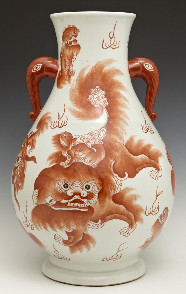 Oriental Baluster Porcelain Vase, 20th c., with orange: Oriental Baluster Porcelain Vase, 20th c., with orange Foo lion decoration and elephant head handles, on a white ground, H.- 14 1/2 in., Dia.- 9 in.