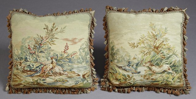 Pair of Down Filled Petit Point Throw Pillows, 20th c.,: Pair of Down Filled Petit Point Throw Pillows, 20th c., constructed of 19th c. fabric depicting classical hunting scenes, with tasseled fringe, H.- 21 in., W.- 22 in., D.- 6 in.