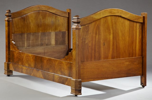 French Empire Style Carved Walnut Day Bed, late 19th: French Empire Style Carved Walnut Day Bed, late 19th c., the reeded arched crest head and footboard with stepped chamfered stiles, to a stepped foot on casters, joined by a wide rail, H.- 45 in., W.- 