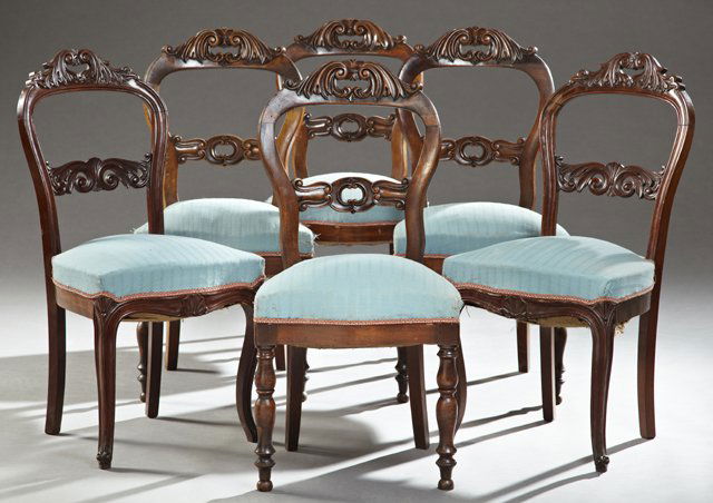 Associated Set of Six French Balloon Back Carved: Associated Set of Six French Balloon Back Carved Mahogany Dining Chairs, 19th c., the foliate carved pierced handled chairs over pierced foliate horizontal splats, to bowed seats, with four chairs hav