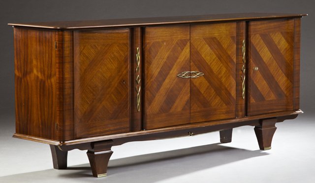 French Art Deco Ormolu Mounted Carved Kingwood: French Art Deco Ormolu Mounted Carved Kingwood Sideboard, c. 1930, the crotched top over two central curved cupboard doors, flanked by serpentine cupboard doors, on a stepped plinth, to square tapered