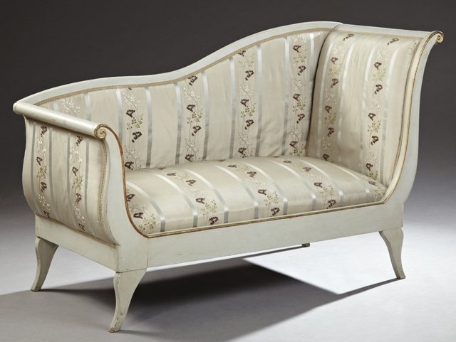 Continental Regency Style Parcel Gilt Polychrome Carved: Continental Regency Style Parcel Gilt Polychrome Carved Mahogany Settee, 19th c., of recamier form, the serpentine back over a cushion bench seat within scrolled arms to splayed legs, now in taupe pai