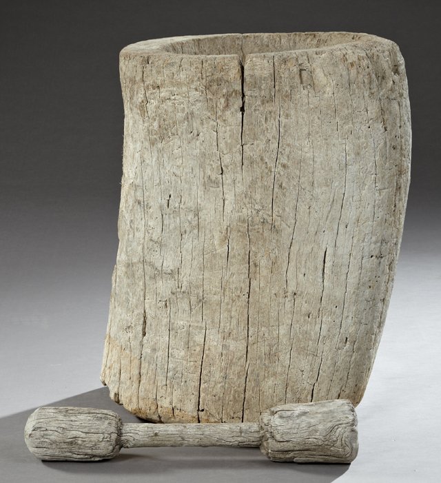 Southern Primitive Carved Cypress Mortar and Pestle,: Southern Primitive Carved Cypress Mortar and Pestle, 19th c., hollowed out from a single log, with a double sided pestle for grinding grain, H.- 29 in., Dia.- 22 in.