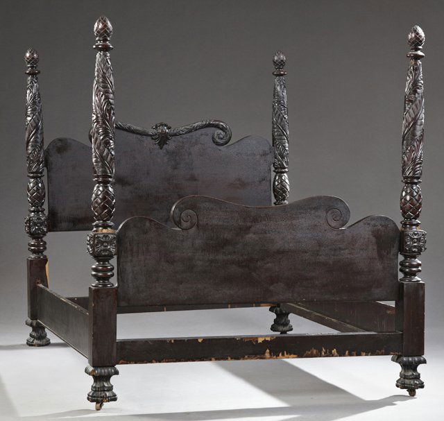 American Classical Revival Carved Mahogany Four Poster: American Classical Revival Carved Mahogany Four Poster Bed, late 19th c., the serpentine scrolling headboard centered by a cabochon medallion, flanked by relief carved acanthine posts with pineapple f