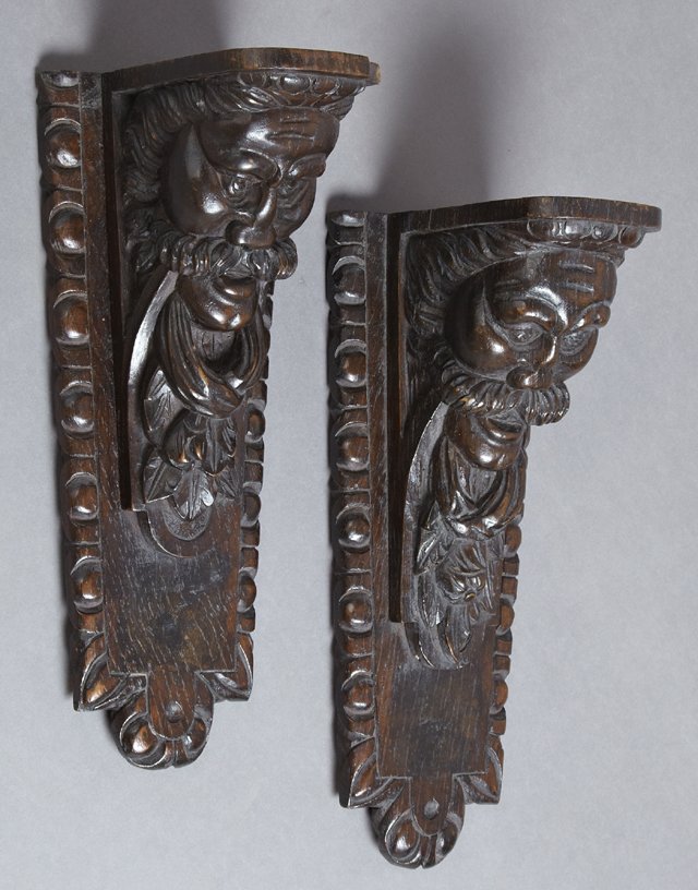Pair of Continental Carved Mahogany Wall Brackets, 19th: Pair of Continental Carved Mahogany Wall Brackets, 19th c., with figural male supports on tapered back plates, H.- 15 1/4 in., W.- 6 1/4 in., D.- 6 3/4 in.