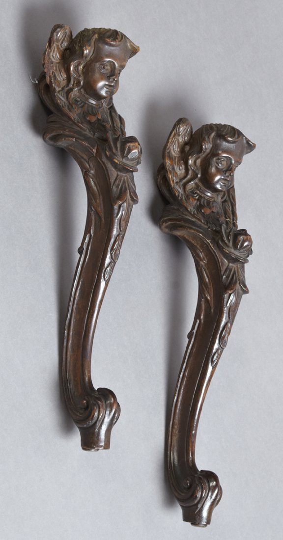 Pair of Carved Wooden Architectural Elements, c. 1900,: Pair of Carved Wooden Architectural Elements, c. 1900, the tops surmounted by angel heads, H.- 17 3/4 in., W.- 4 3/4 in., D.- 4 3/4 in.
