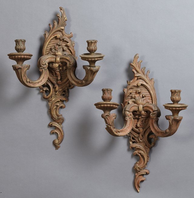 Pair of Louis XV Style Carved Beech Two Light Wall: Pair of Louis XV Style Carved Beech Two Light Wall Sconces, early 20th c., the scroll mounted medallion back plate issuing two scrolled arms with carved candle cups on circular bobeches, having been e