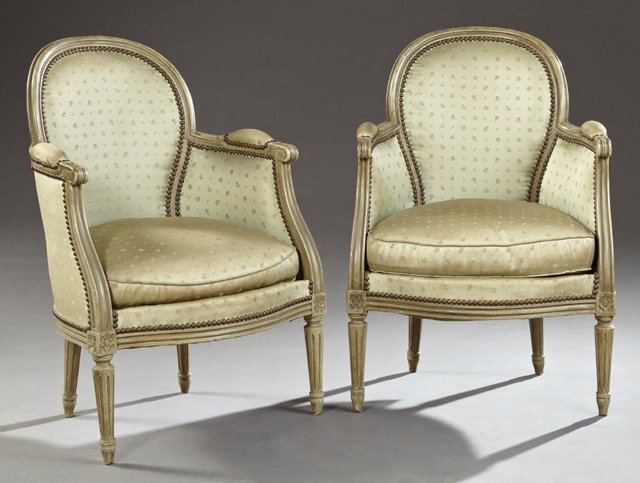 Pair of French Louis XVI Style Polychromed Carved Beech: Pair of French Louis XVI Style Polychromed Carved Beech Bergeres, early 20th c., the reeded oval upholstered back over bowed cushioned seats within reeded upholstered arms, on reeded tapered legs to F