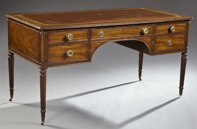 American Sheraton Style Carved Mahogany Desk, 20th c.,: American Sheraton Style Carved Mahogany Desk, 20th c., by Kittinger, the inset gilt tooled brown leather top over a central frieze drawer flanked by two short drawers over two deeper drawers, on ring