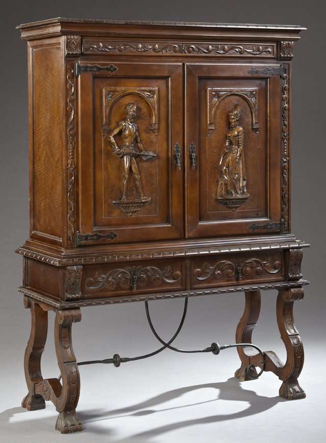 Spanish Renaissance Style Carved Mahogany Cupboard, 20t: Spanish Renaissance Style Carved Mahogany Cupboard, 20th c., the carved ogee crown over a foliate carved frieze above two figural carved cupboard doors representing Don Quijote and Dulcinea, on a base