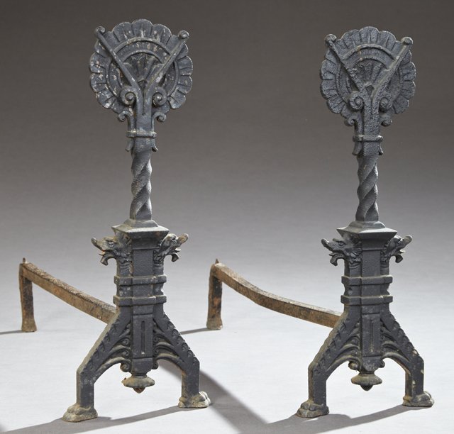 Pair of American Cast Iron Andirons, late 19th c., with: Pair of American Cast Iron Andirons, late 19th c., with floriform tops on flat tapered supports to stepped splayed leg bases with dragon head decoration, on paw feet, H.- 19 in., W.- 17 1/2 in., D.- 2