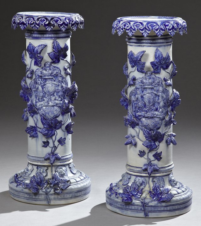 Pair of German Grey Salt Glaze Stoneware Pedestals,: Pair of German Grey Salt Glaze Stoneware Pedestals, late 19th c., probably Westerwald, with Prussian Blue decoration throughout, the dished relief edge top over a foliate skirt, on a columnar support 