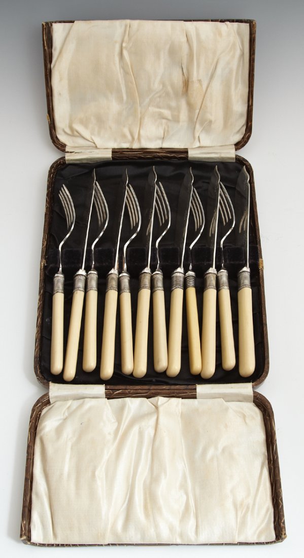 Cased Twelve Piece Silverplated Fish Set, early 20th: Cased Twelve Piece Silverplated Fish Set, early 20th c., consisting of six knives and six forks, all with ivory handles, in original fitted faux alligator case.