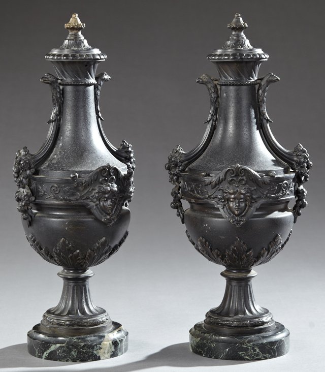Pair of Patinated Spelter Garniture Baluster Urns, 19th: Pair of Patinated Spelter Garniture Baluster Urns, 19th c., with floral relief and mask mounts on reeded socle supports, on highly figured verde antico marble bases, H.- 18 1/2 in., W.- 7 3/4 in., D.-
