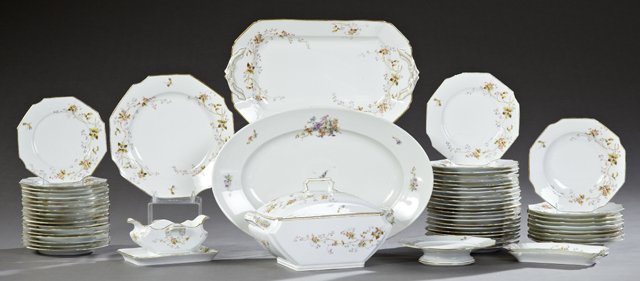 French Fifty-Six Piece Set of Porcelain Dinnerware,: French Fifty-Six Piece Set of Porcelain Dinnerware, late 19th c., with paint enhanced floral decoration, consisting of 22 octagonal dinner plates, 18 octagonal salad plates, 9 octagonal soups, octagon