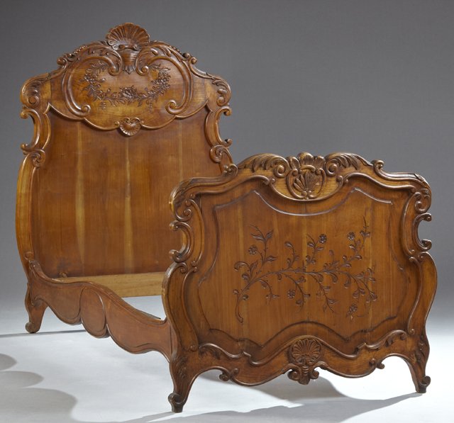 French Provincial Carved Cherry Bed, 19th c., the: French Provincial Carved Cherry Bed, 19th c., the serpentine arched shell carved headboard with incised decoration joined by serpentine rails to an arched serpentine scrolling acanthus carved footboar