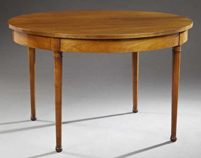 French Provincial Directoire Style Carved Cherry: French Provincial Directoire Style Carved Cherry Circular Dining Table, 19th c., the circular top over a wide skirt, on ring turned tapered legs to ball feet, now lacking leaves, H.- 29 1/4 in., Dia.-