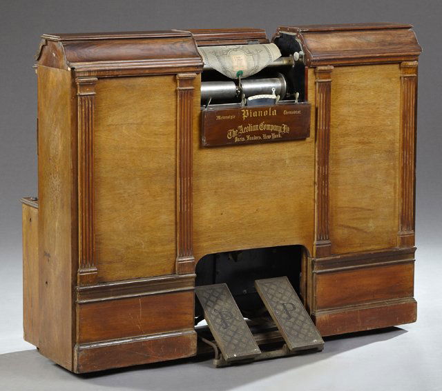 Neoclassical Style Carved Rosewood and Walnut Roll Top: Neoclassical Style Carved Rosewood and Walnut Roll Top Operated Pianola Player Piano, c. 1900, by the AEolian Company, with Metrostyle and Thermodist technology, sixty-five notes, No. 10746, including