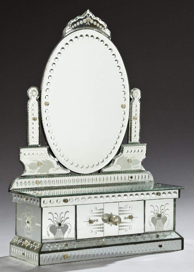 Venetian Style Dressing Mirror, early 20th c., the oval: Venetian Style Dressing Mirror, early 20th c., the oval mirror on a base with a central drawer, H.- 27 7/8 in., W.- 19 in., D.- 6 3/4 in.