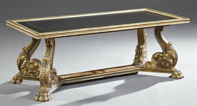 French Louis XVI Style Parcel Gilt and Gesso Mirror Top: French Louis XVI Style Parcel Gilt and Gesso Mirror Top Coffee Table, 20th c., the rectangular inset gilt banded mirror top within a molded edge on S-scrolled acanthus carved supports to carved paw fe