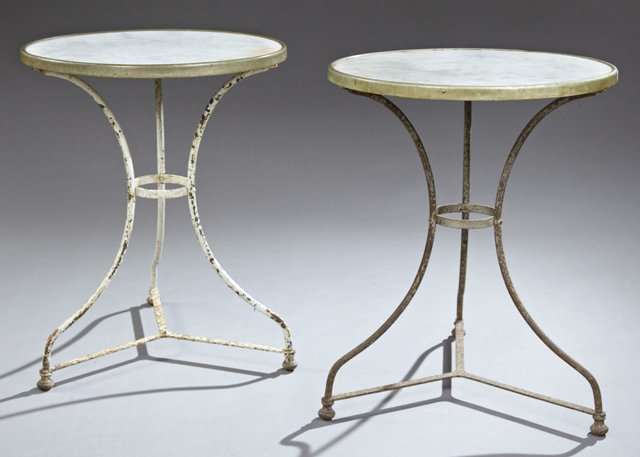 Pair of French Brass and Wrought Iron Marble Top Bistro: Pair of French Brass and Wrought Iron Marble Top Bistro Tables, early 20th c., the circular tops with brass banding, on tripodal legs to ball feet joined by a flat stretcher, H.- 27 1/2 in., Dia.- 21 