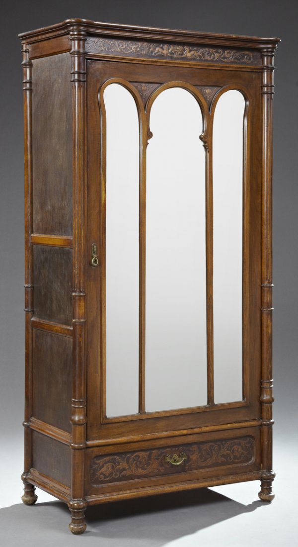 French Louis XVI Style Carved Birch Armoire, late 19th: French Louis XVI Style Carved Birch Armoire, late 19th c., in the Art Nouveau taste, the stepped cookie corner crown over a pressed decorated frieze, above a triple wide beveled glazed panel door over