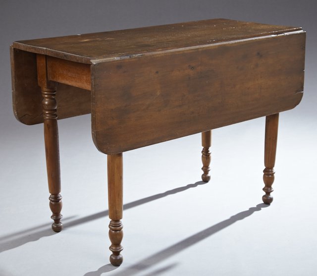 American Federal Carved Walnut Drop Leaf Dining Table,: American Federal Carved Walnut Drop Leaf Dining Table, 19th c., the rectangular top over a wide skirt, on ring turned tapered legs to ball feet, Closed- H.- 28 7/8 in., W.- 41 1/4 in., D.- 19 1/8 in.,