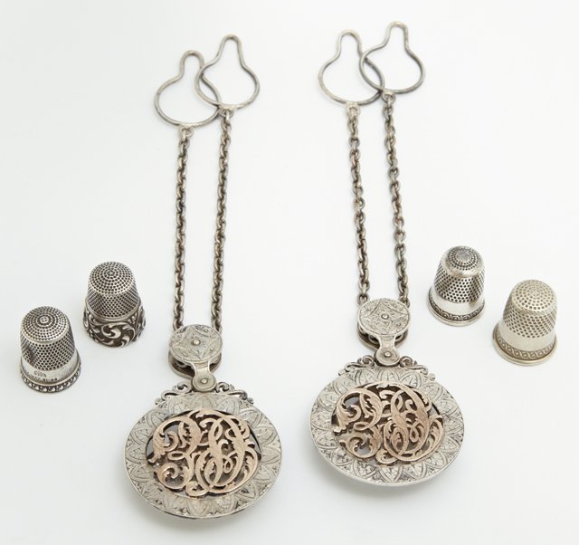 Group of Six Items, c. 1900, consisting of a pair of: Group of Six Items, c. 1900, consisting of a pair of sterling and gold chatelaine clips, made by Adler, New Orleans, and four sterling thimbles. (6 Pcs.)