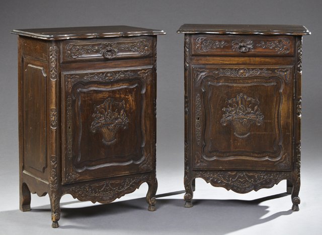 Rare Pair of Louis XV Style Carved Beech Confituriers,: Rare Pair of Louis XV Style Carved Beech Confituriers, late 19th c., the scalloped fielded top panel over floral carved drawers and floral basket cupboard doors with iron fiche hinges and long escutch