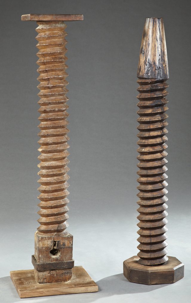Two French Provincial Carved Elm Pedestals, 19th c.,: Two French Provincial Carved Elm Pedestals, 19th c., constructed from wine press screws, one example on a square base, the second example on an octagonal base, Largest- H.- 55 1/4 in., Dia.- 16 in.