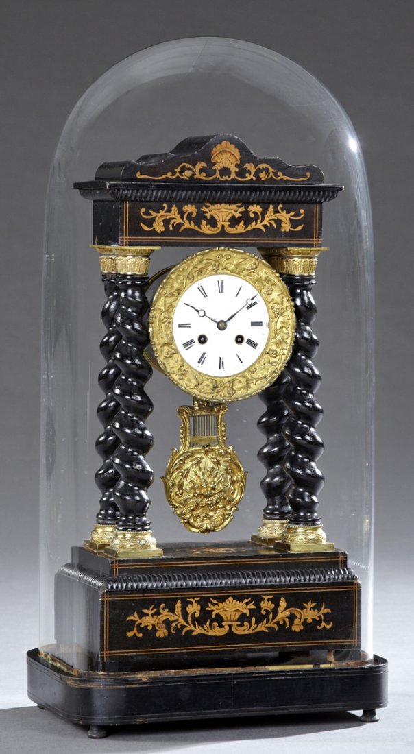 Bronze Ormolu Mounted Inlaid Ebonized Portico Clock, c.: Bronze Ormolu Mounted Inlaid Ebonized Portico Clock, c. 1870, time and strike, the arched inlaid crown over a bronze rimmed enamel dial within ormolu mounted twist columns, on a stepped inlaid base, w