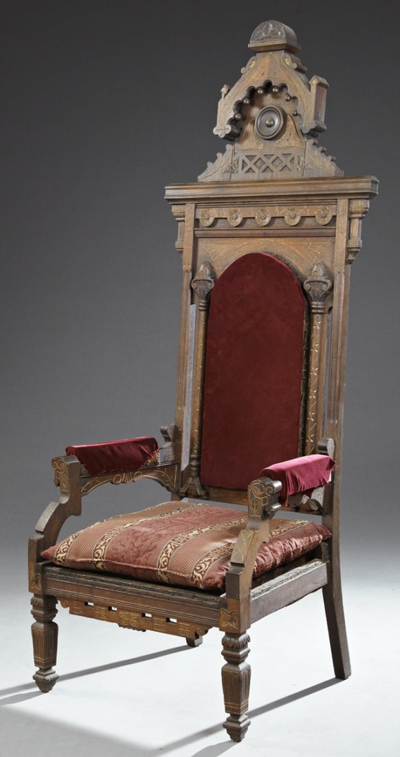 American Eastlake Parcel Gilt Carved Oak "Throne": American Eastlake Parcel Gilt Carved Oak "Throne" Armchair, c. 1890, the arched carved crest above an arched upholstered back flanked by incised columns, over a square seat within upholstered arms wit